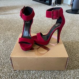 Red heels, only wore a couple of times. In good condition.